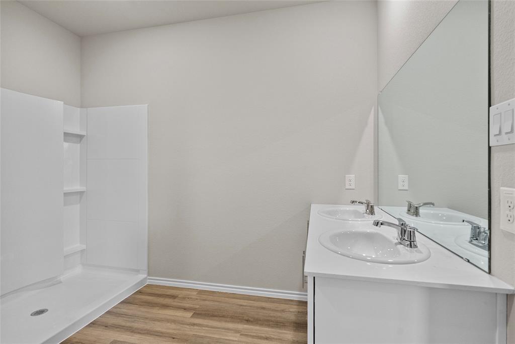 904 Traction Trail Cleburne, TX 76031 - Photo 15 of 27 a bathroom with a sink and a mirror