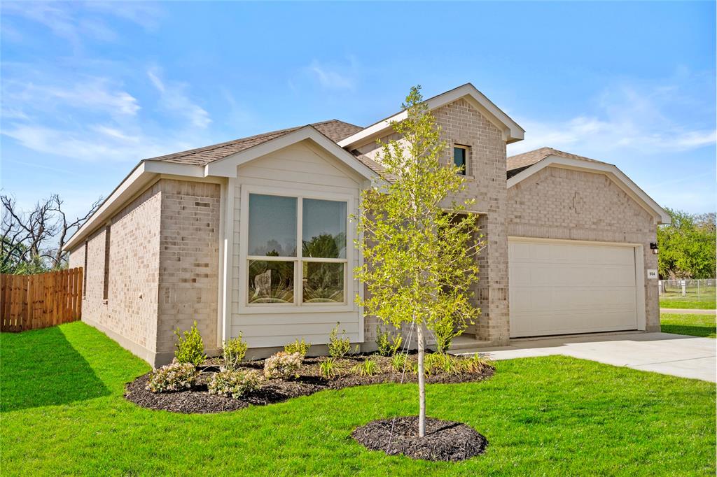 904 Traction Trail Cleburne, TX 76031 - Photo 2 of 27 a front view of a house with a yard