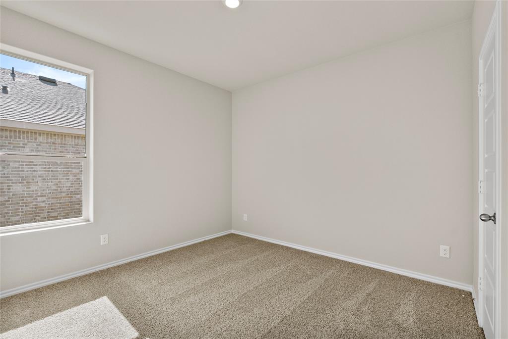 904 Traction Trail Cleburne, TX 76031 - Photo 21 of 27 a view of an empty room with a window