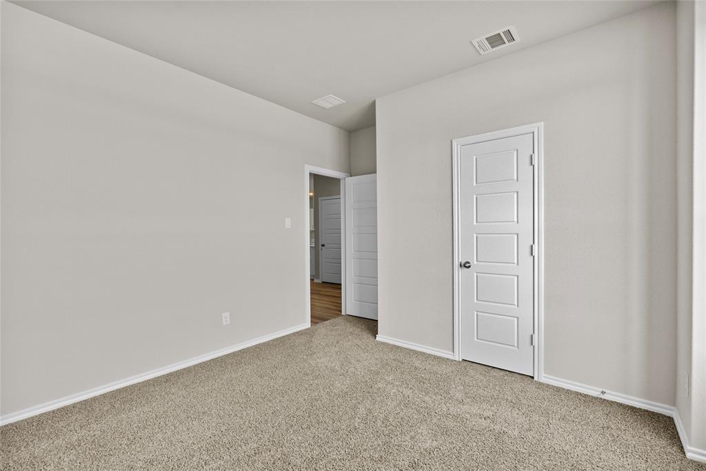 904 Traction Trail Cleburne, TX 76031 - Photo 22 of 27 an empty room with closet area