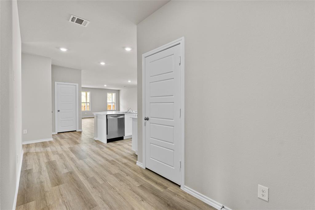 904 Traction Trail Cleburne, TX 76031 - Photo 4 of 27 a view of a kitchen with a refrigerator and a sink