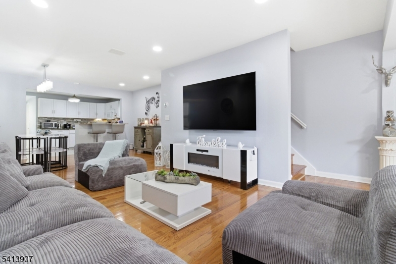 32 Cedar Avenue Elizabeth, NJ 07202 - Photo 1 of 32 a living room with furniture and a flat screen tv