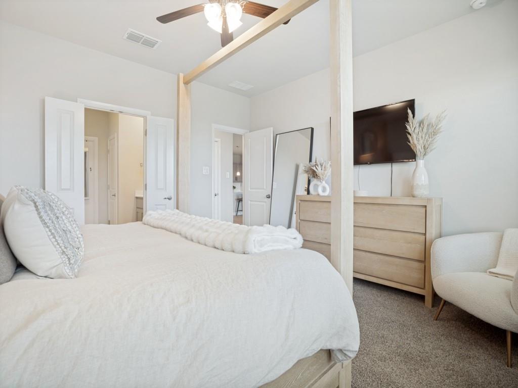1612 Reed Drive Krum, TX 76249 - Photo 14 of 25 Carpeted room with a ceiling fan, light-toned walls, and white panel doors