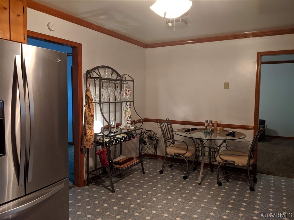 6900 Berrystone Road Chesterfield, VA 23831 - Photo 13 of 23 a view of a dining room with furniture and a chandelier