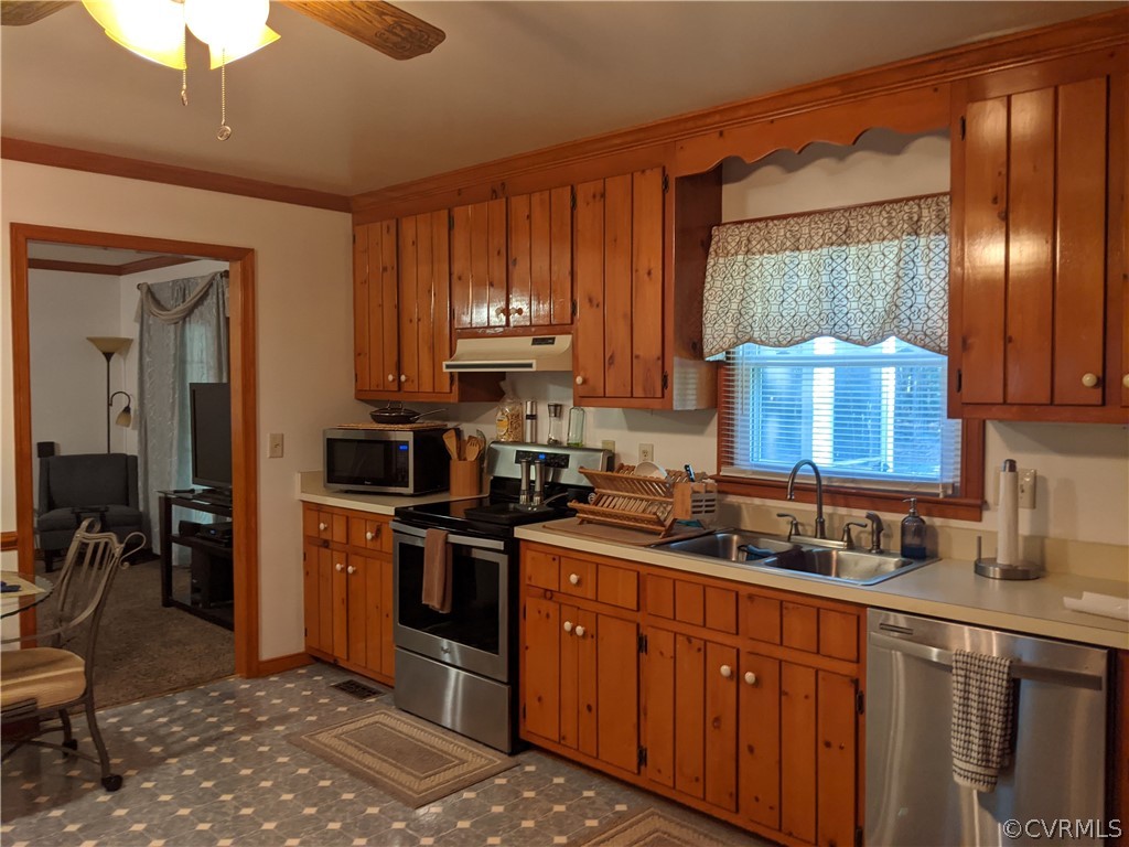 6900 Berrystone Road Chesterfield, VA 23831 - Photo 14 of 23 a kitchen with stainless steel appliances granite countertop a stove a sink dishwasher and a microwave oven with cabinets
