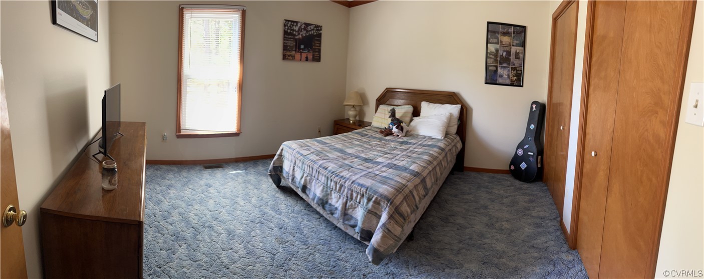 6900 Berrystone Road Chesterfield, VA 23831 - Photo 19 of 23 a bedroom with a bed and a window