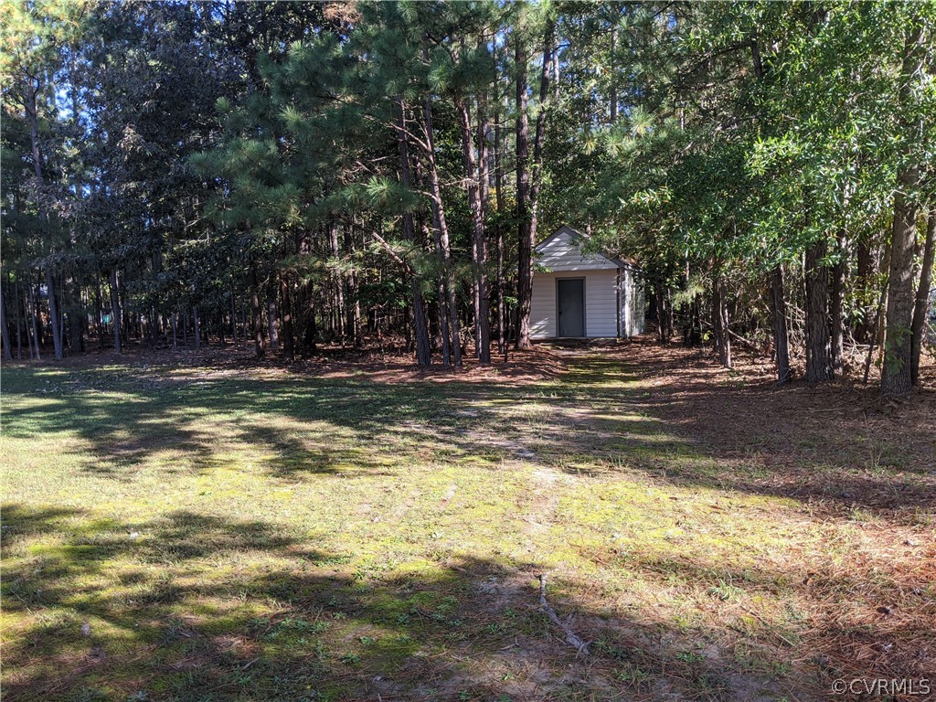 6900 Berrystone Road Chesterfield, VA 23831 - Photo 6 of 23 a swimming pool view with large trees