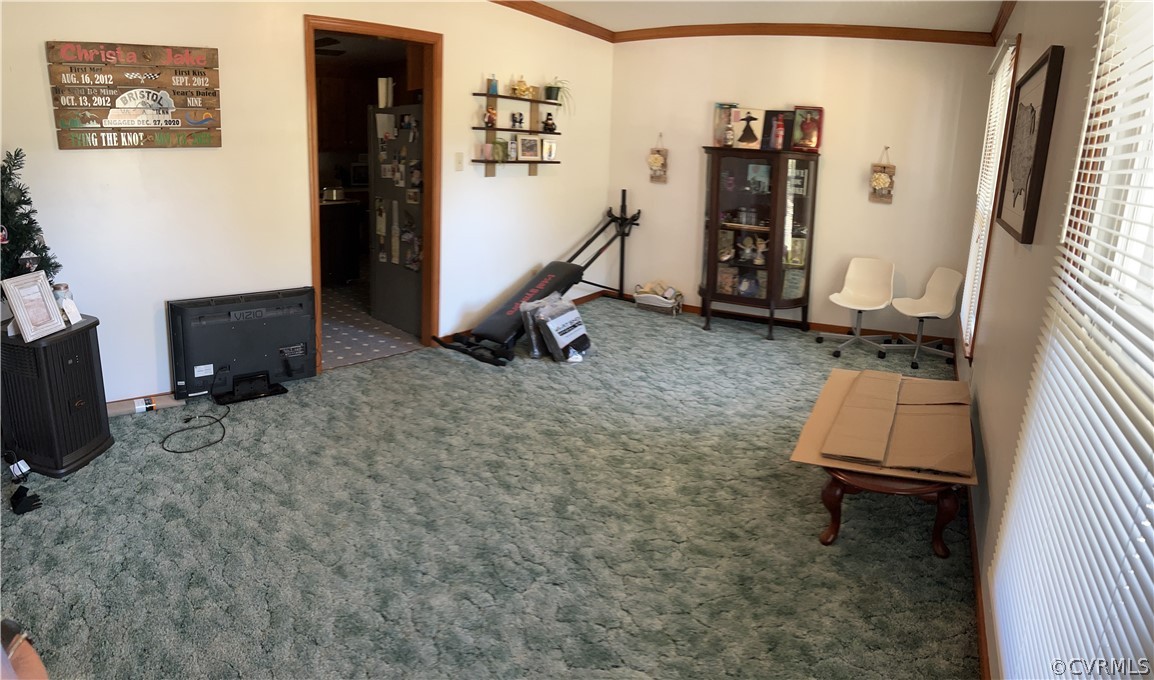6900 Berrystone Road Chesterfield, VA 23831 - Photo 9 of 23 a room with gym equipment and a flat screen tv