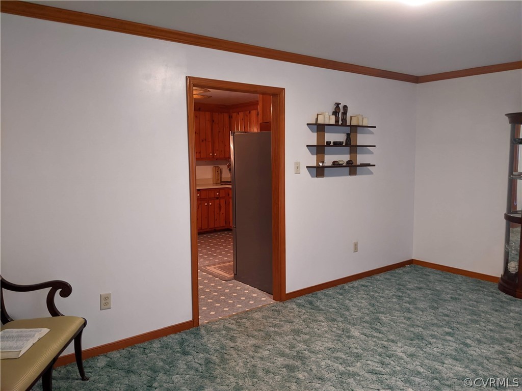 6900 Berrystone Road Chesterfield, VA 23831 - Photo 10 of 23 a view of a livingroom with wooden floor and a refrigerator
