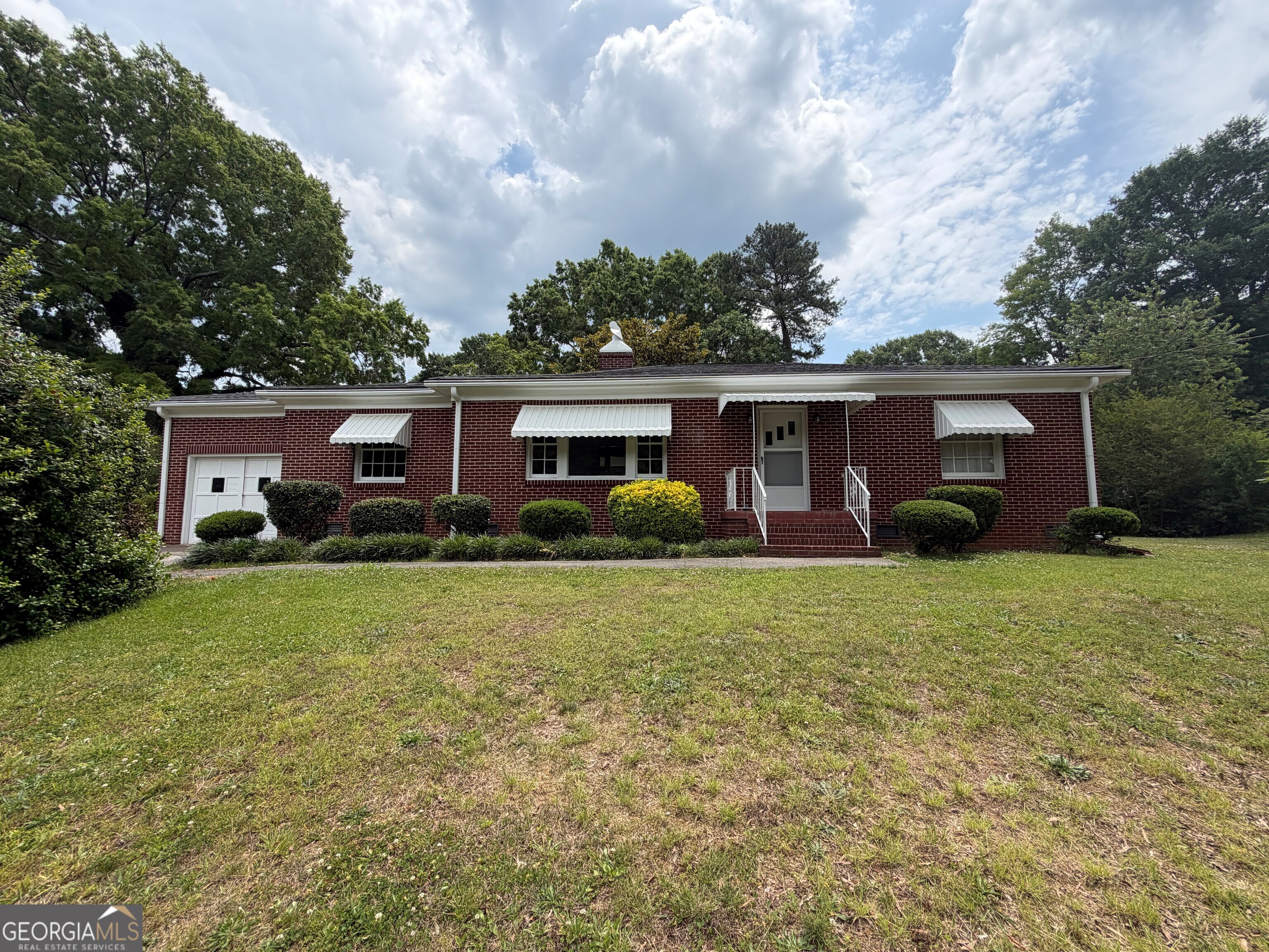 2619 Maple Road Southeast Rome, GA 30161 - Photo 1 of 31 front view of a house with a yard