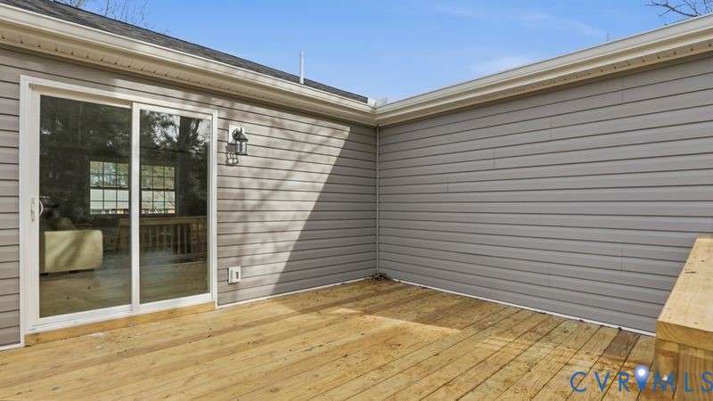 25209 Ritchie Avenue Petersburg, VA 23803 - Photo 42 of 50 a view of a backyard space with wooden floor and a potted plant