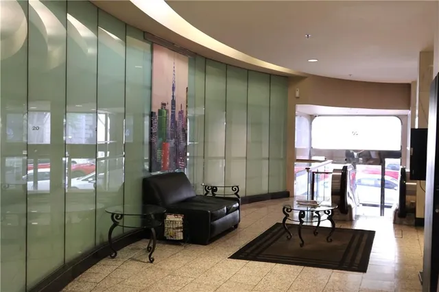 a couple of cars parked in front of buildings