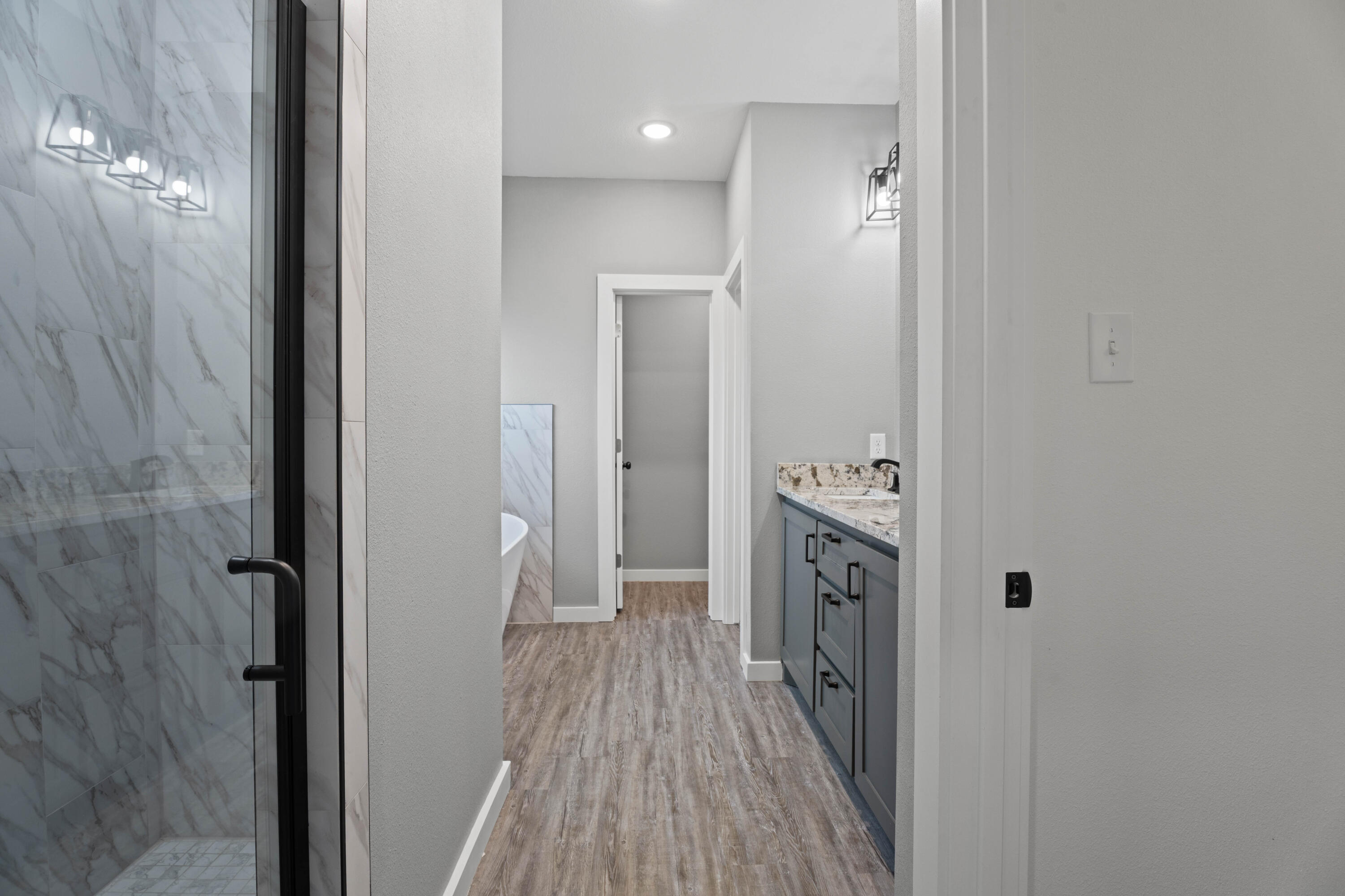 310 East 16th Street Wolfforth, TX 79382 - Photo 15 of 30 a bathroom with a sink a toilet and shower