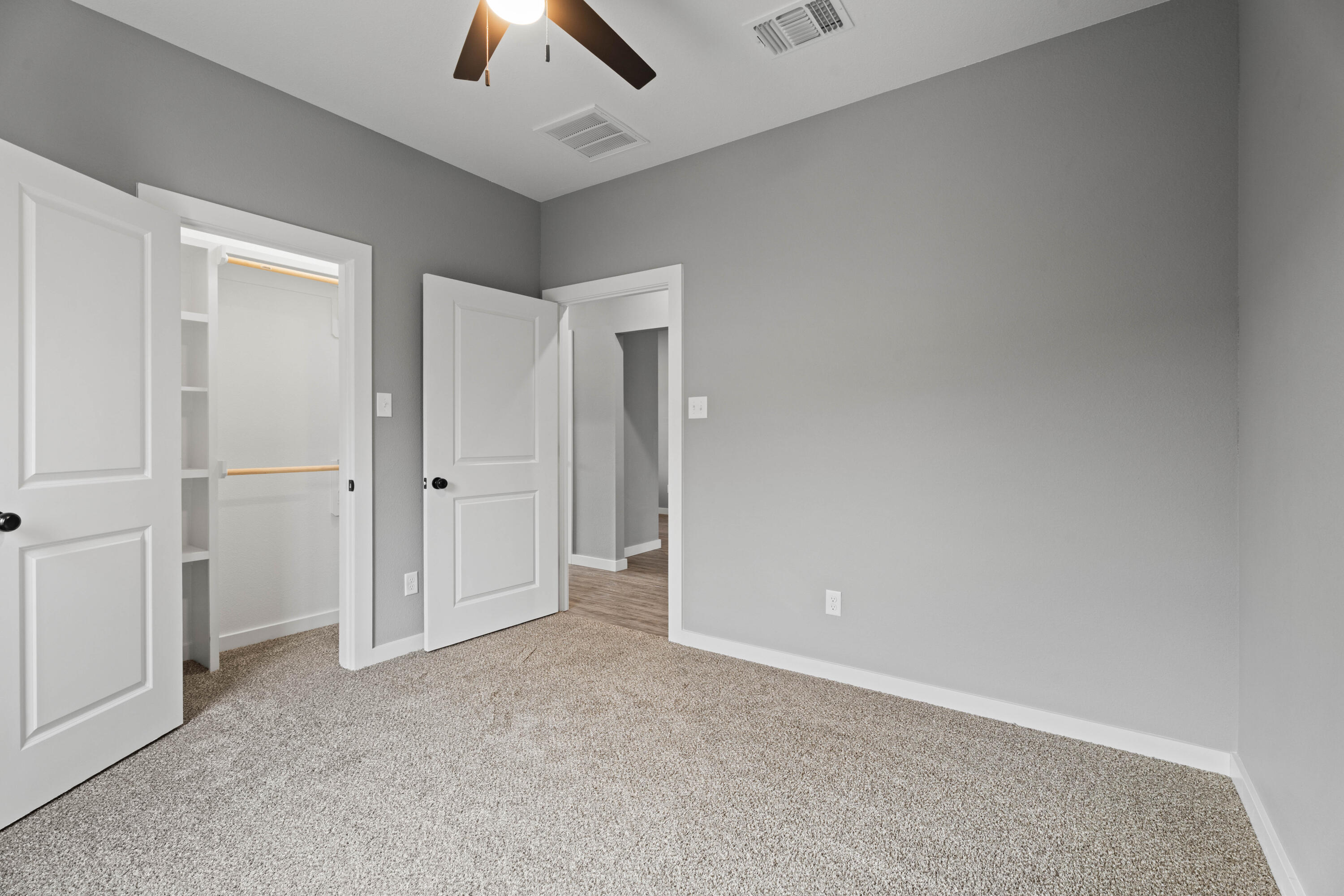 310 East 16th Street Wolfforth, TX 79382 - Photo 24 of 30 an empty room with chandelier fan