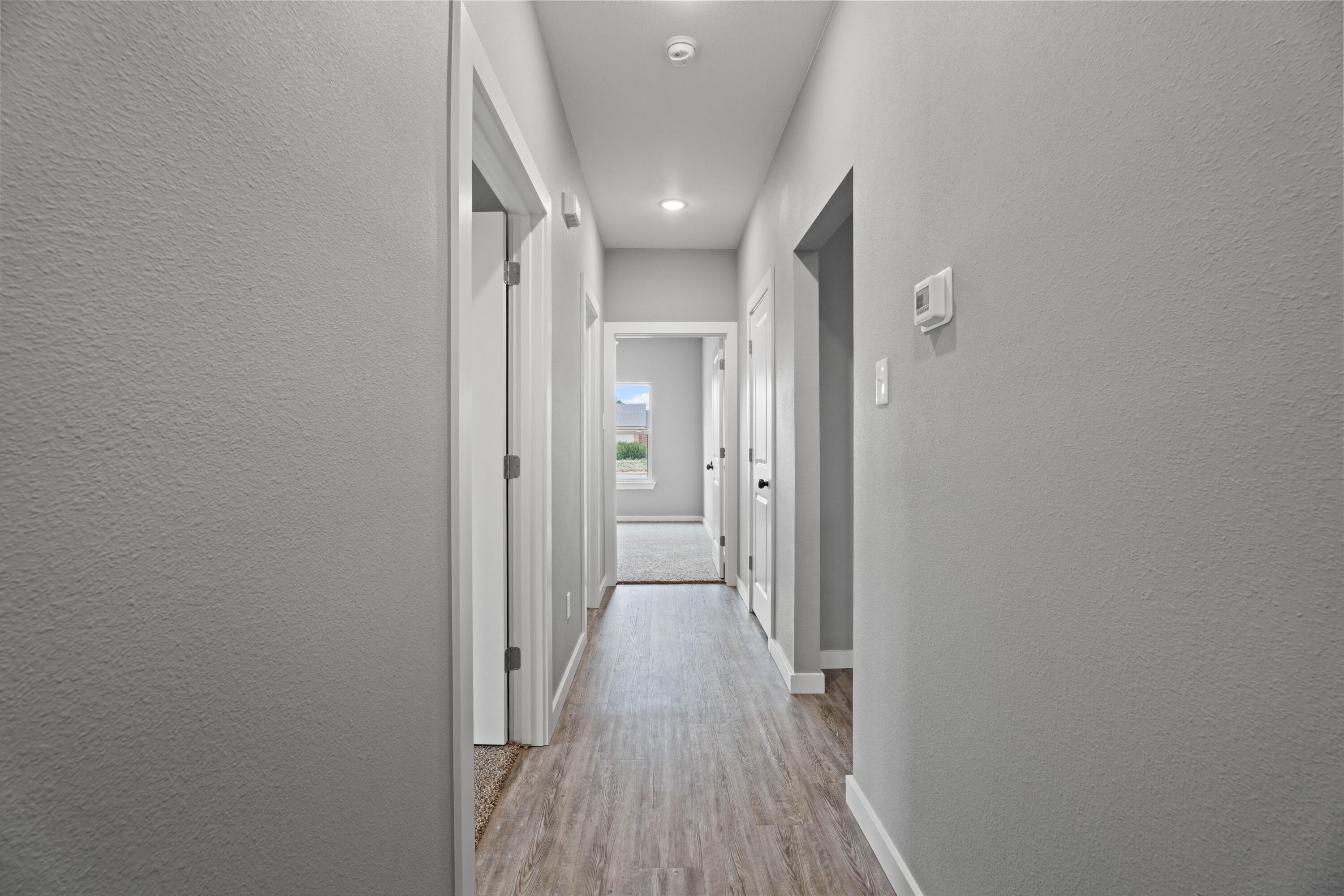 310 East 16th Street Wolfforth, TX 79382 - Photo 28 of 30 a view of hallway with wooden floor