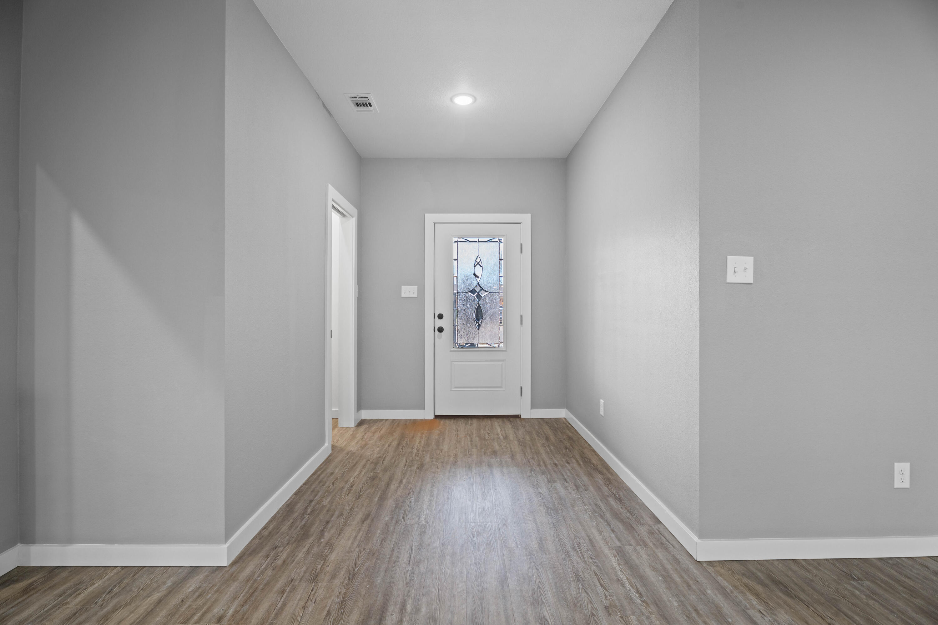 310 East 16th Street Wolfforth, TX 79382 - Photo 29 of 30 a view of hallway with wooden floor