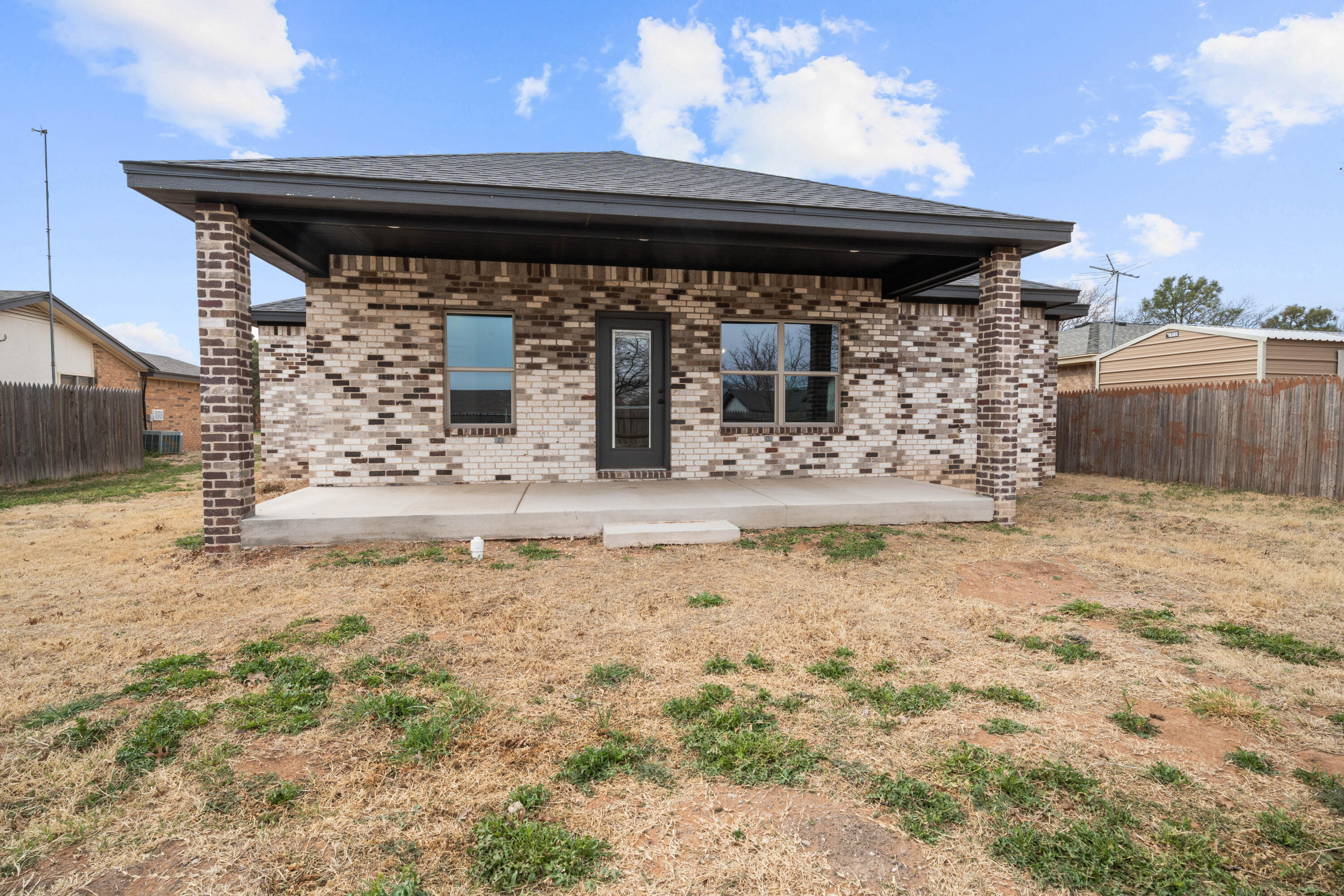 310 East 16th Street Wolfforth, TX 79382 - Photo 30 of 30 a view of house with wooden fence