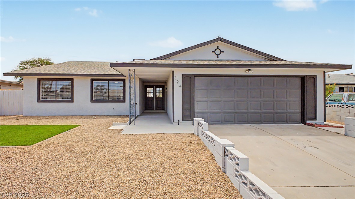324 Lakehurst Road Las Vegas, NV 89145 - Photo 1 of 30 Clean architectural lines and low-maintenance desert landscaping define this single-story home's exterior presentation.