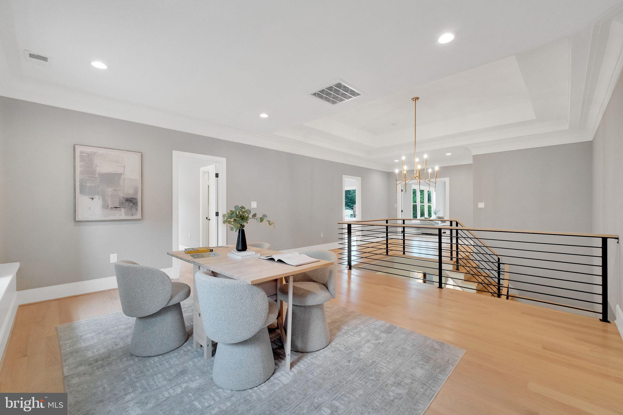 6226 Kellogg Drive McLean, VA 22101 - Photo 33 of 89 a dining room with wooden floor a chandelier a glass table and chairs