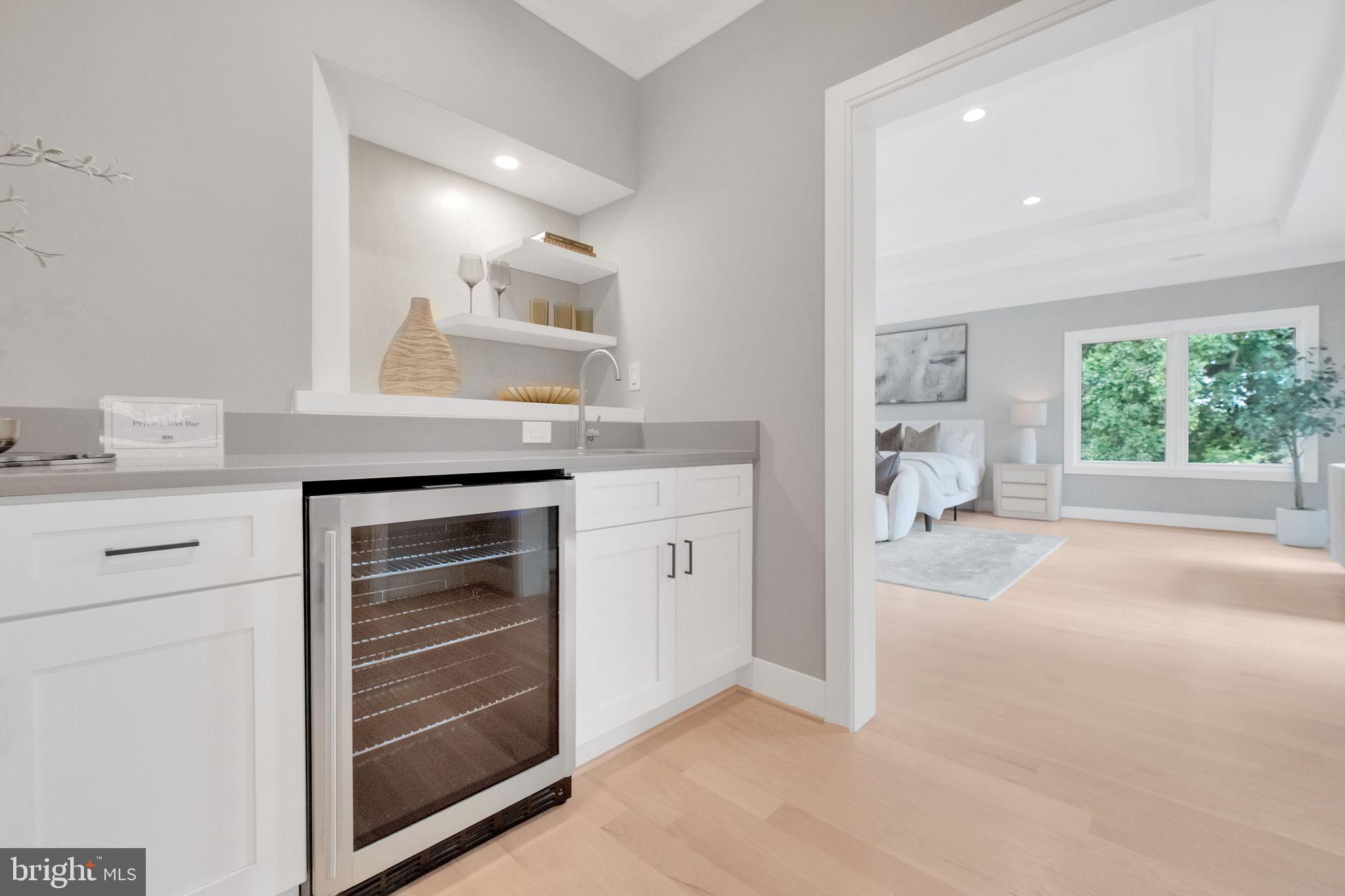 6226 Kellogg Drive McLean, VA 22101 - Photo 40 of 89 a kitchen with white cabinets and a stove with wooden floor