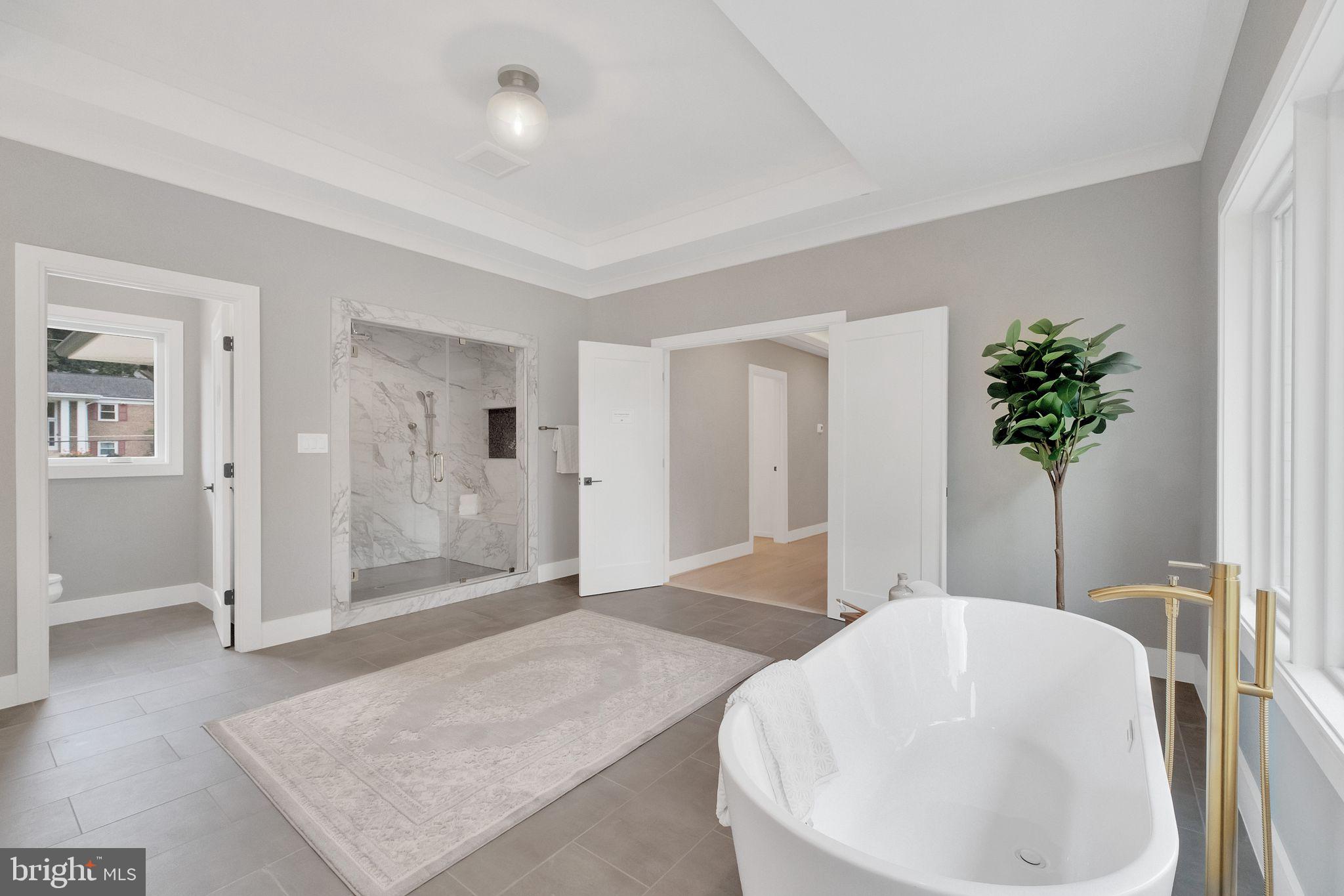 6226 Kellogg Drive McLean, VA 22101 - Photo 46 of 89 a spacious bathroom with a granite countertop sink and a mirror