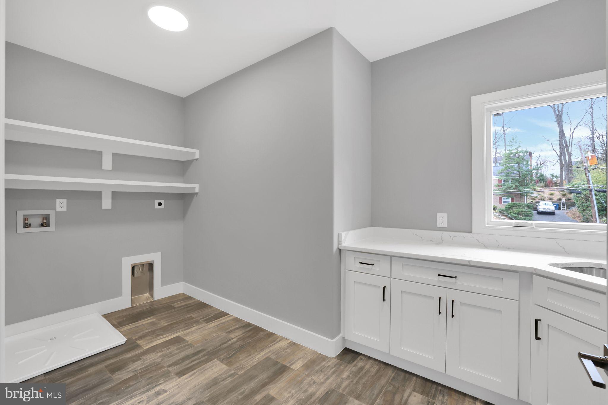 6226 Kellogg Drive McLean, VA 22101 - Photo 51 of 89 a view of cabinets a wooden floor and a window