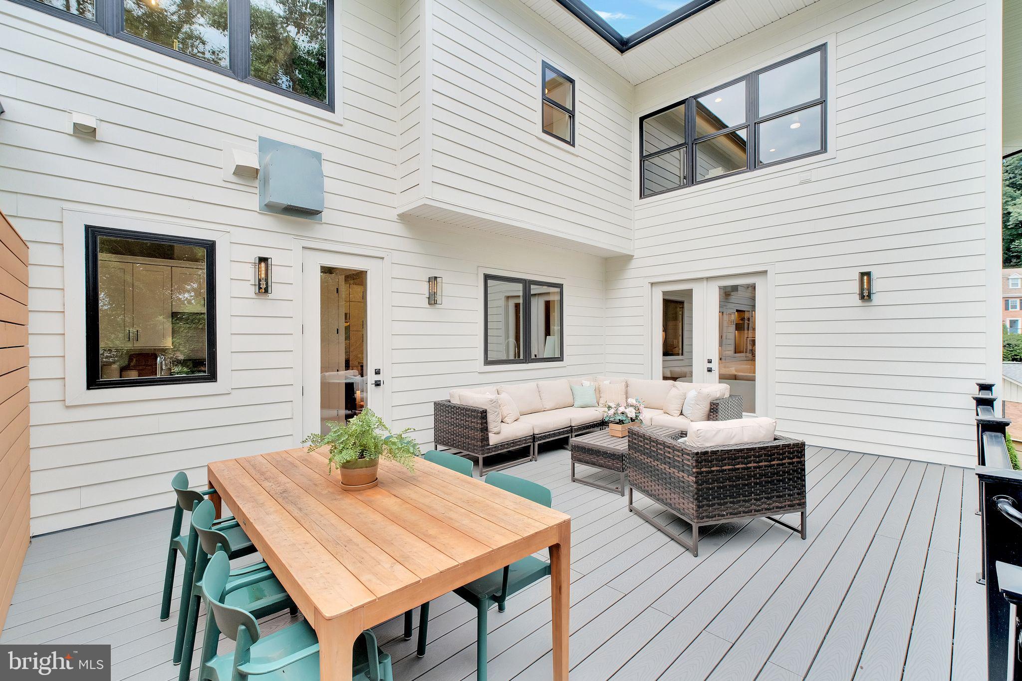6226 Kellogg Drive McLean, VA 22101 - Photo 78 of 89 a backyard of a house with wooden floor chairs sofa and barbecue oven