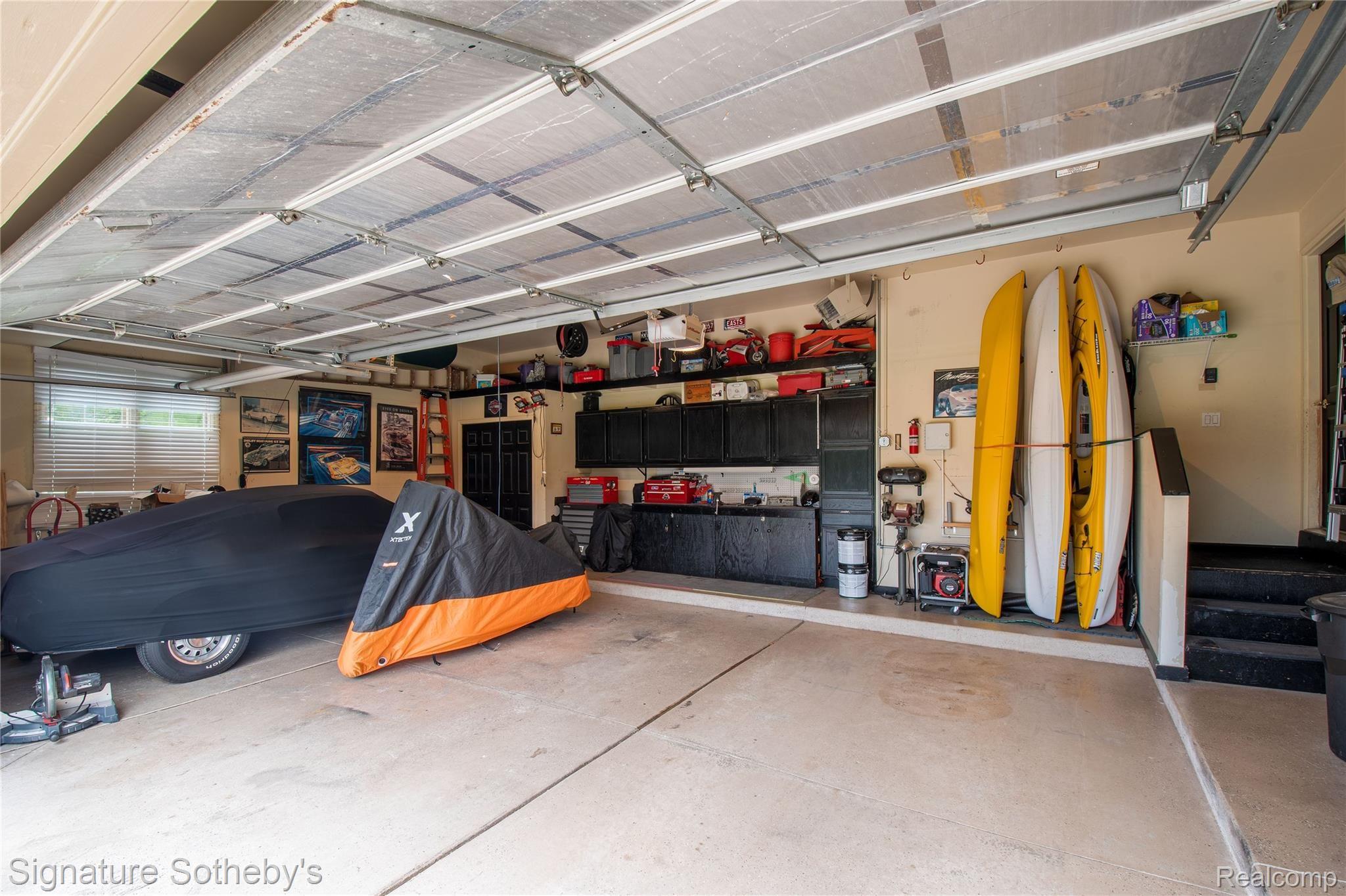 745 West Ridge Court Lake Orion, MI 48359 - Photo 39 of 44 Insulated garage door & plenty of storage cabinets