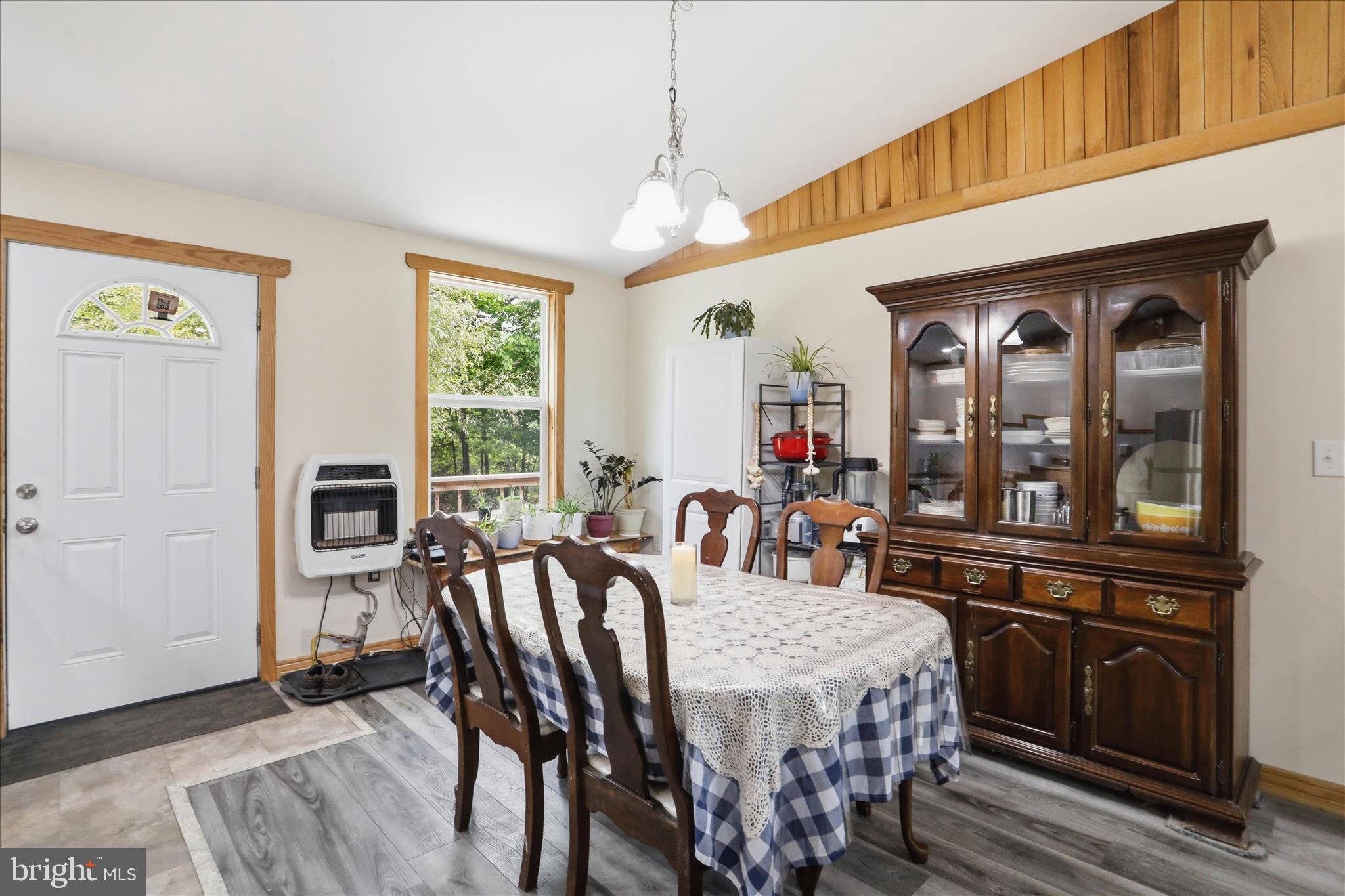 936 Johnny Cake Road Great Cacapon, WV 25422 - Photo 7 of 33 a view of a dining room with furniture window and wooden floor