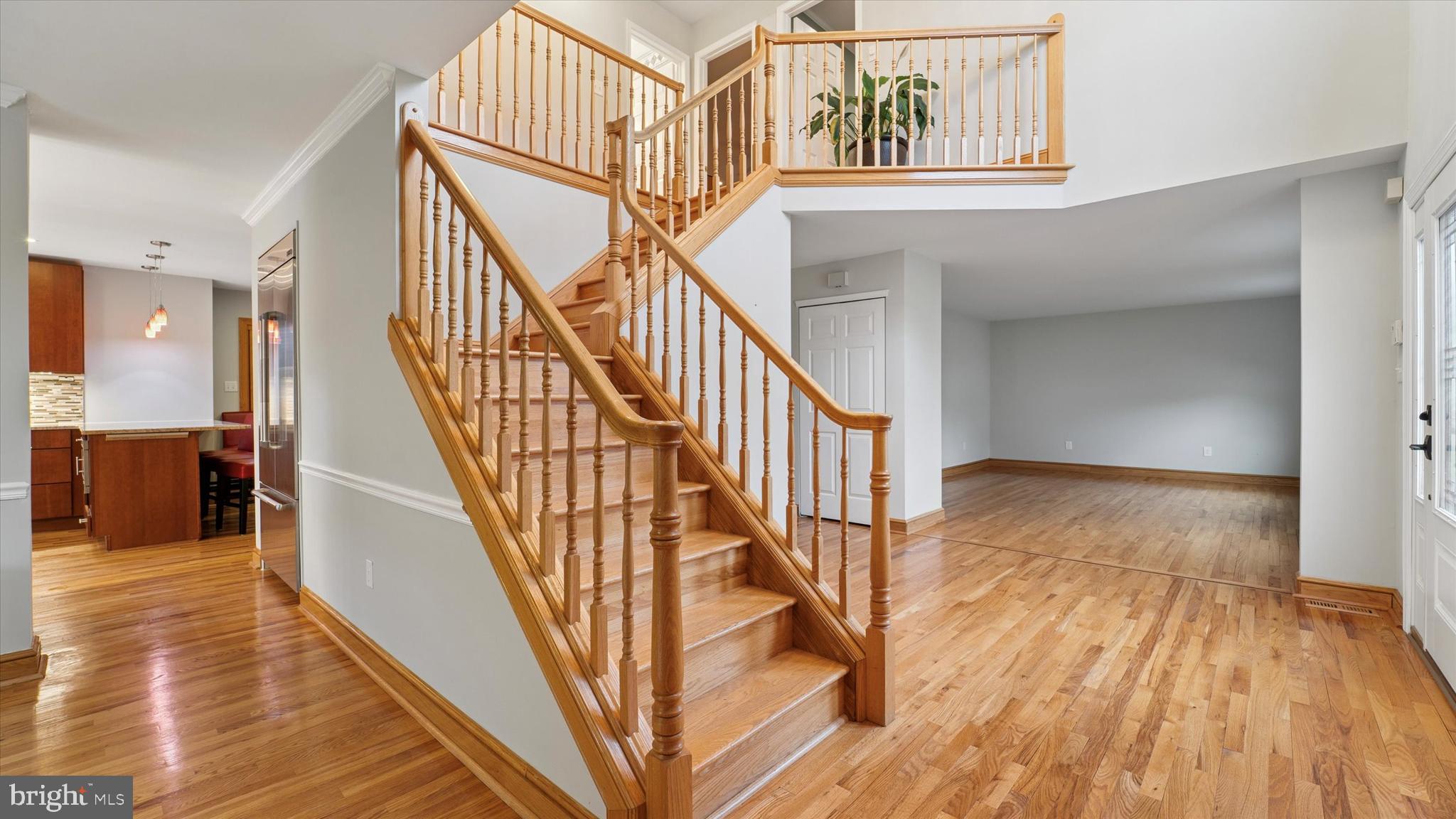 115 Union Mill Terrace Mount Laurel, NJ 08054 - Photo 5 of 31 a view of staircase with lots of frames on wall and wooden floor