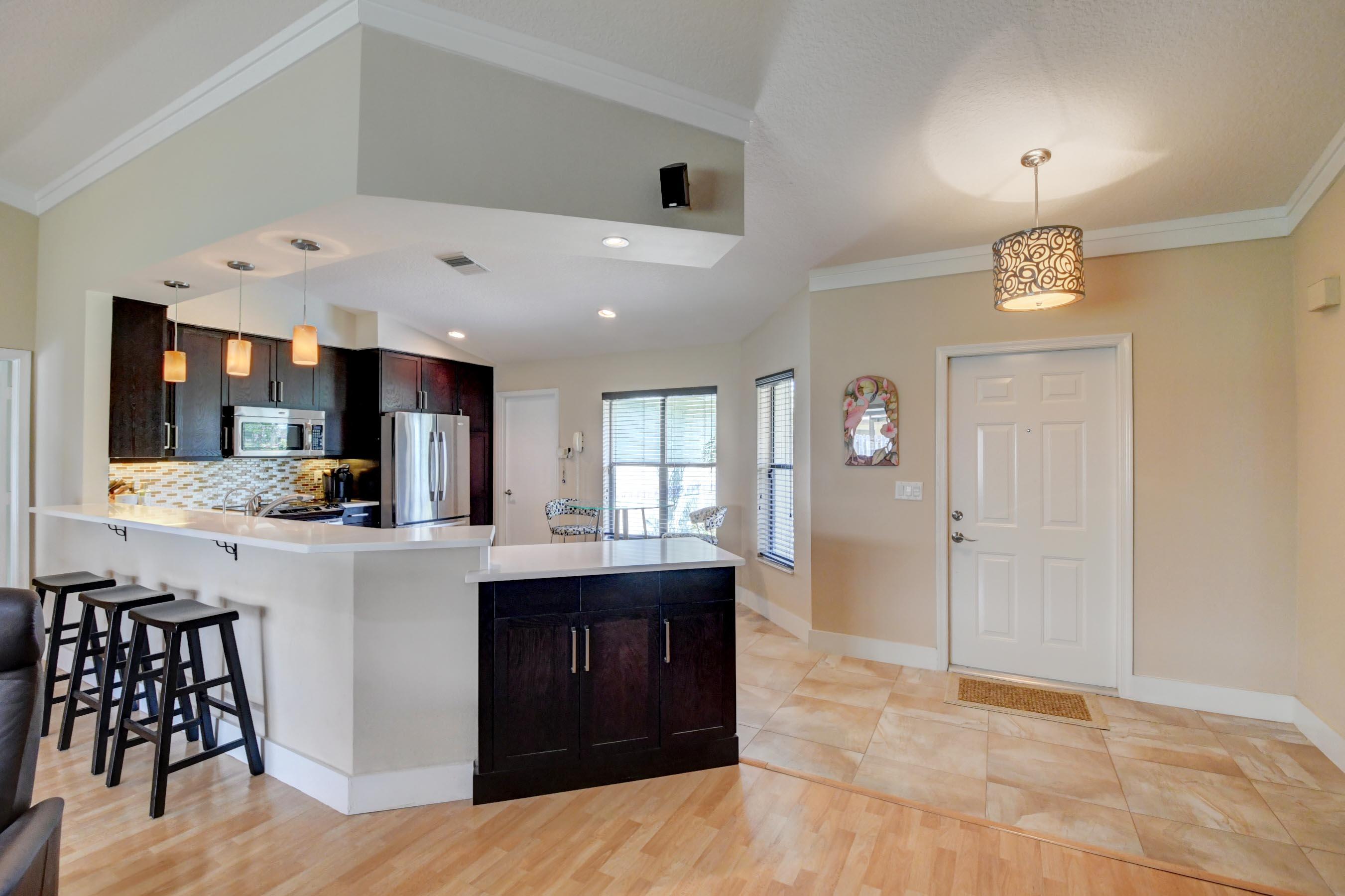 7903 West Country Club Boulevard Boca Raton, FL 33487 - Photo 9 of 32 Kitchen & Front Entry