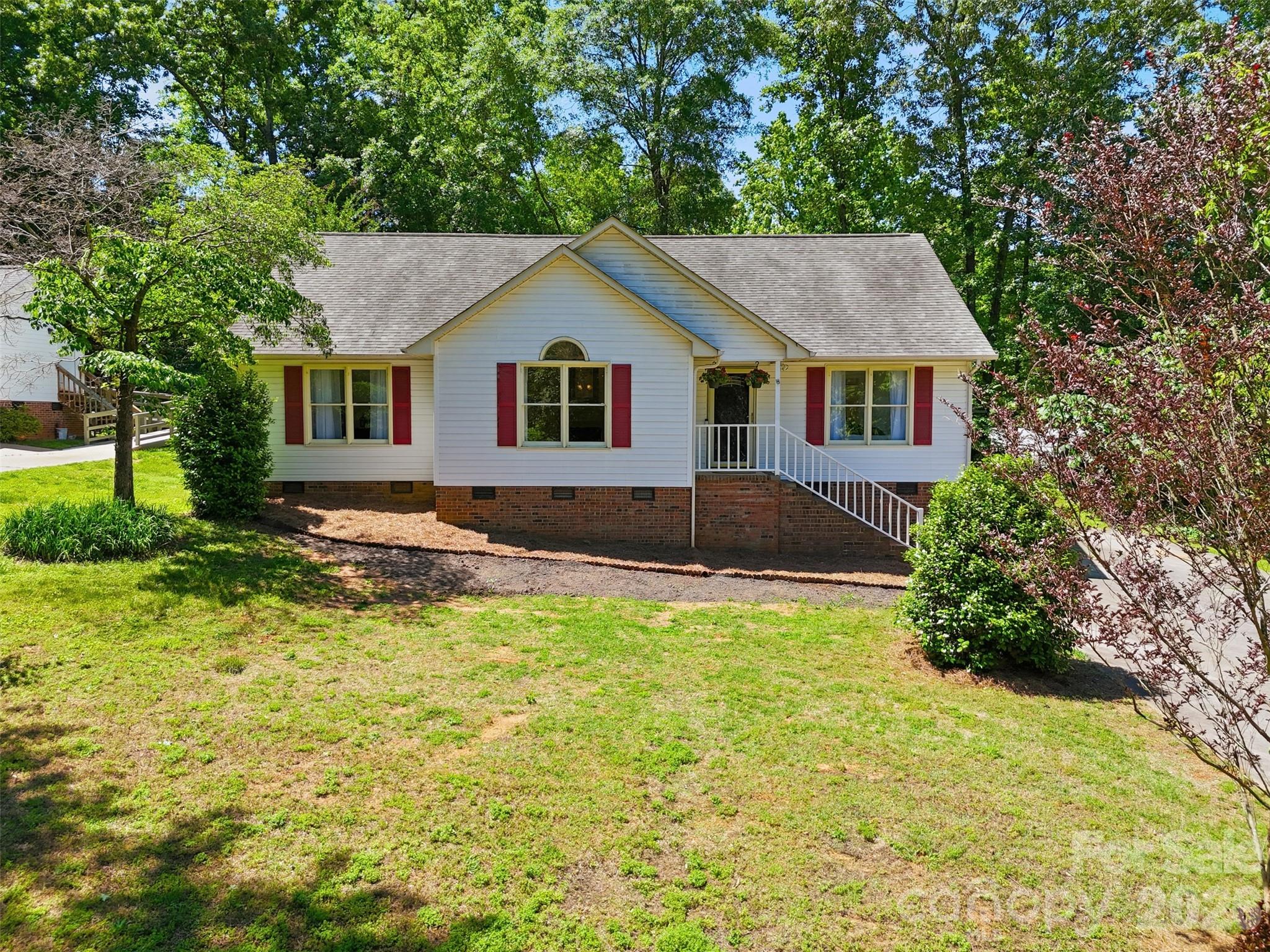 913 Pleasant Ridge Road Fort Mill, SC 29715 - Photo 29 of 40 a front view of house with yard and trees in the background