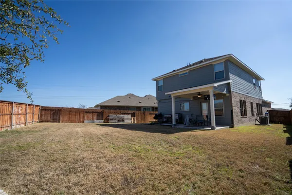 an aerial view of house with a yard