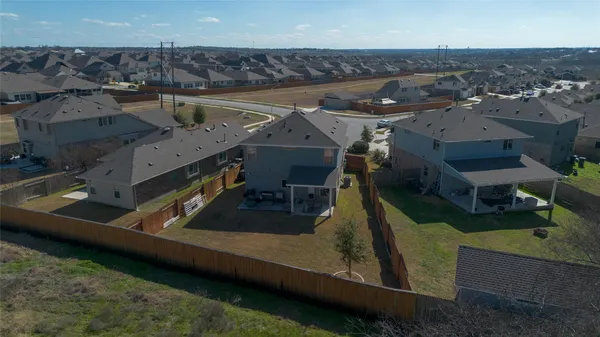 an aerial view of a house with outdoor space
