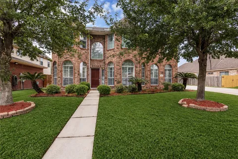 a front view of a house with garden