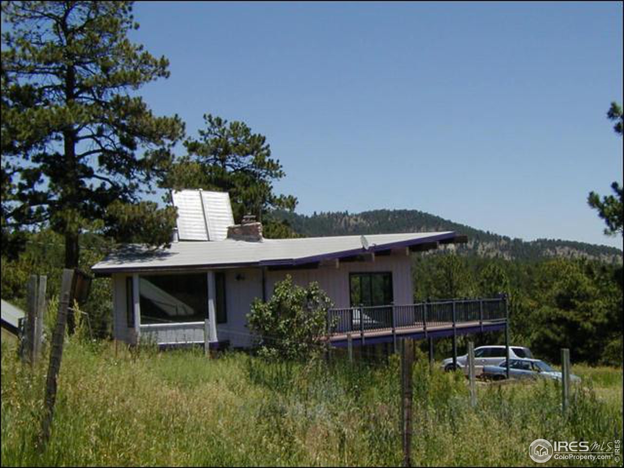3032 Sugarloaf Road Boulder, CO 80302 - Photo 1 of 5 a view of house with swimming pool and a yard