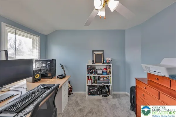 a view of a workspace with furniture