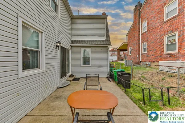 a view of a patio with chairs and table in a patio