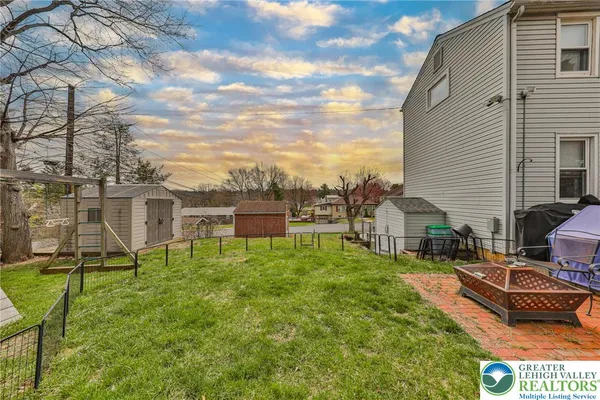 a house view with a sitting space and garden