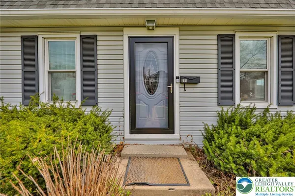 a door view of a house with potted plants