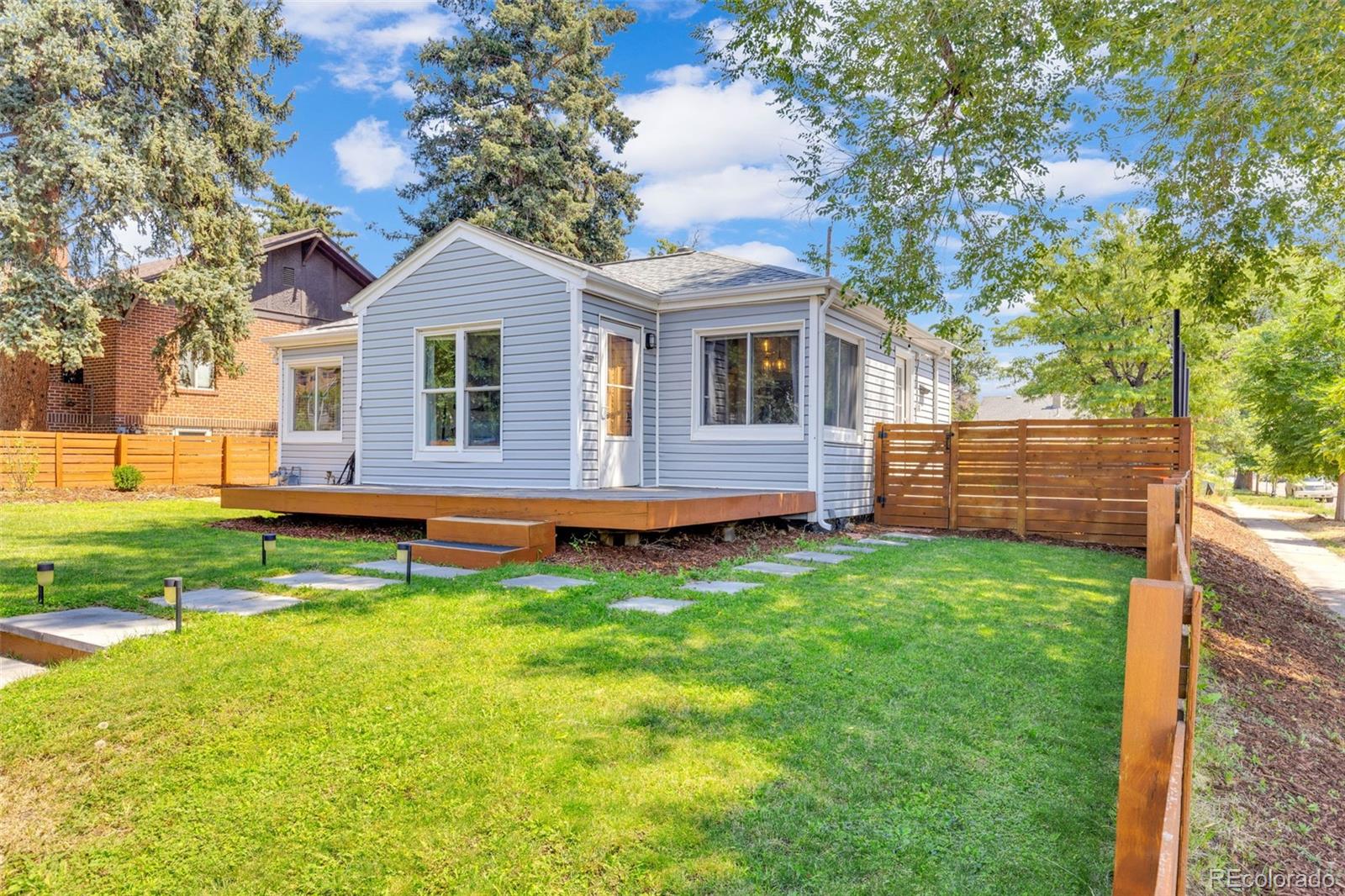 2900 Benton Street Wheat Ridge, CO 80214 - Photo 1 of 43 a front view of house with yard and green space