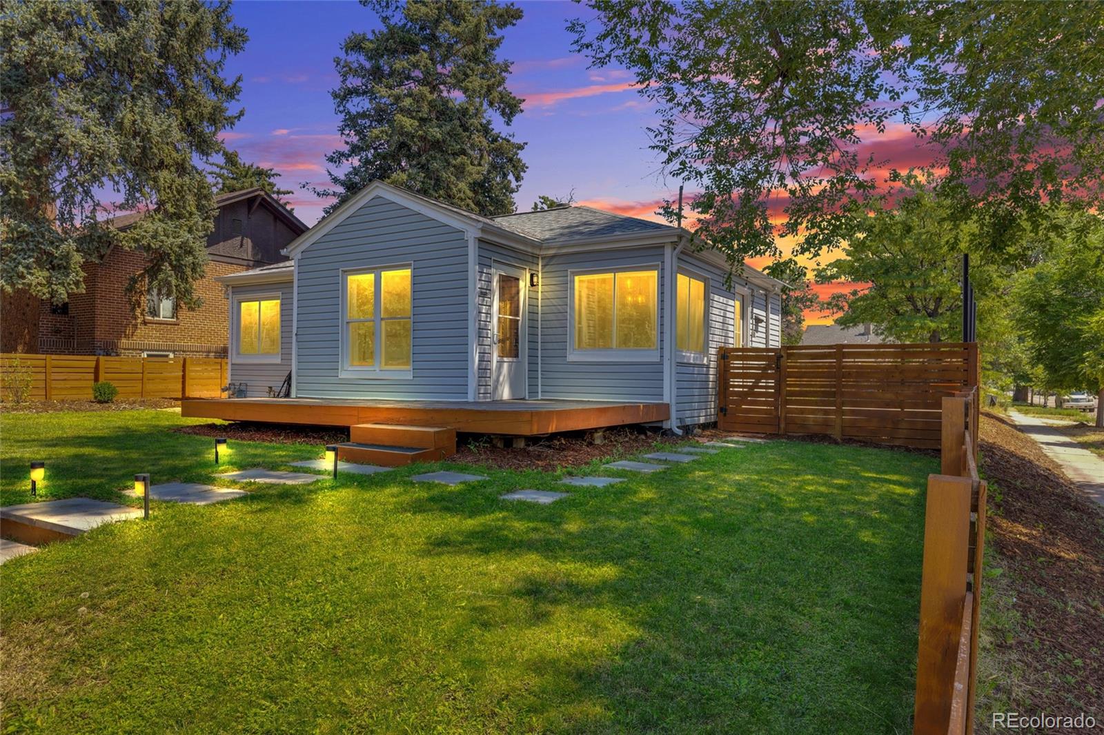 2900 Benton Street Wheat Ridge, CO 80214 - Photo 33 of 43 a front view of a house with a yard