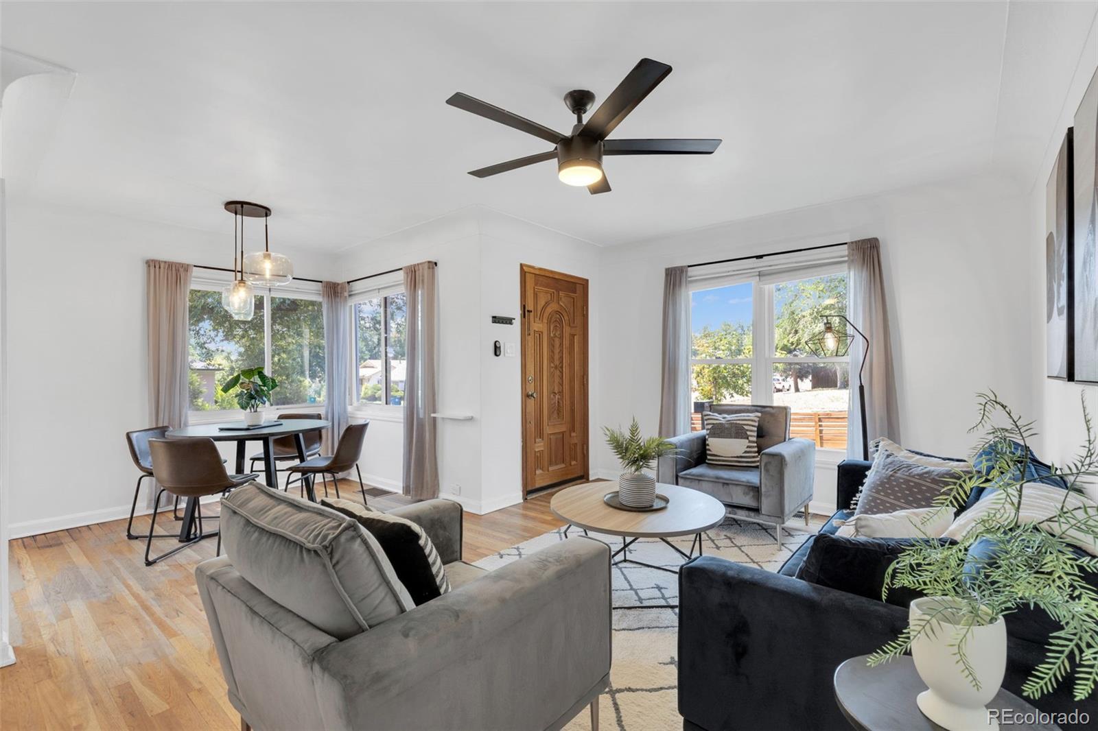 2900 Benton Street Wheat Ridge, CO 80214 - Photo 4 of 43 a living room with furniture wooden floor and a window