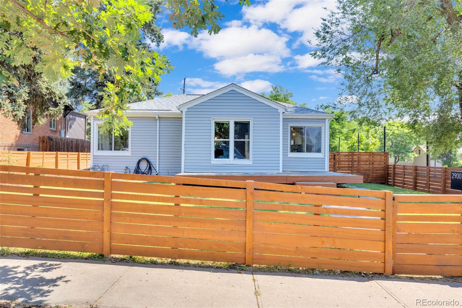 2900 Benton Street Wheat Ridge, CO 80214 - Photo 41 of 43 a view of a house with a swimming pool
