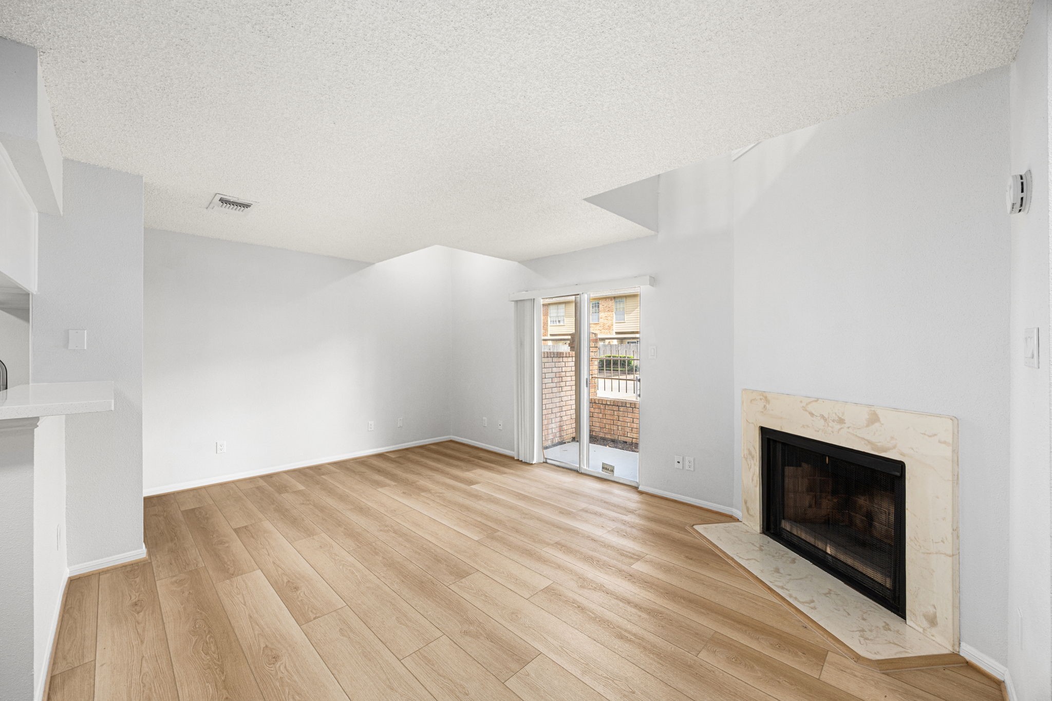 1515 Sandy Springs Road, Unit 2803 Houston, TX 77042 - Photo 7 of 19 Sliding glass doors open off living room to your private patio to relax with your morning coffee.