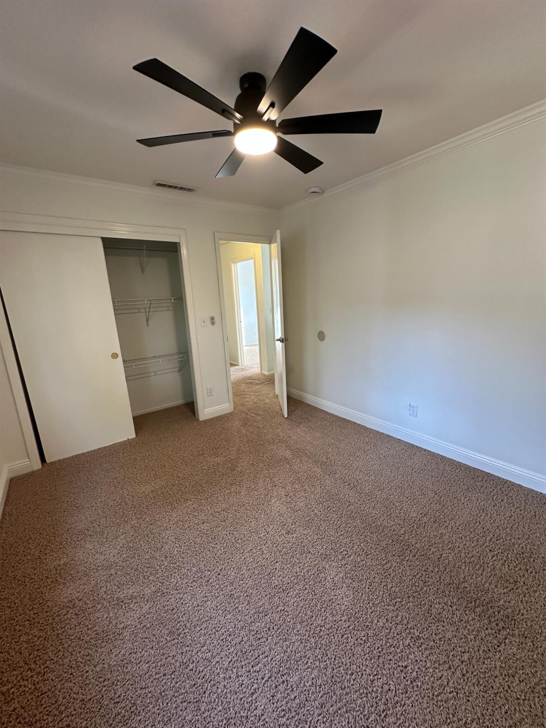 1816 East Frederick Avenue Fresno, CA 93720 - Photo 20 of 29 a view of a livingroom with a ceiling fan and window