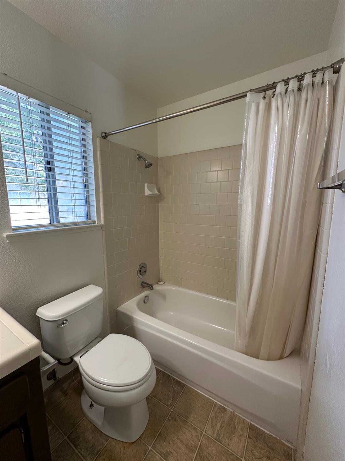 1816 East Frederick Avenue Fresno, CA 93720 - Photo 22 of 29 a bathroom with a toilet and a shower