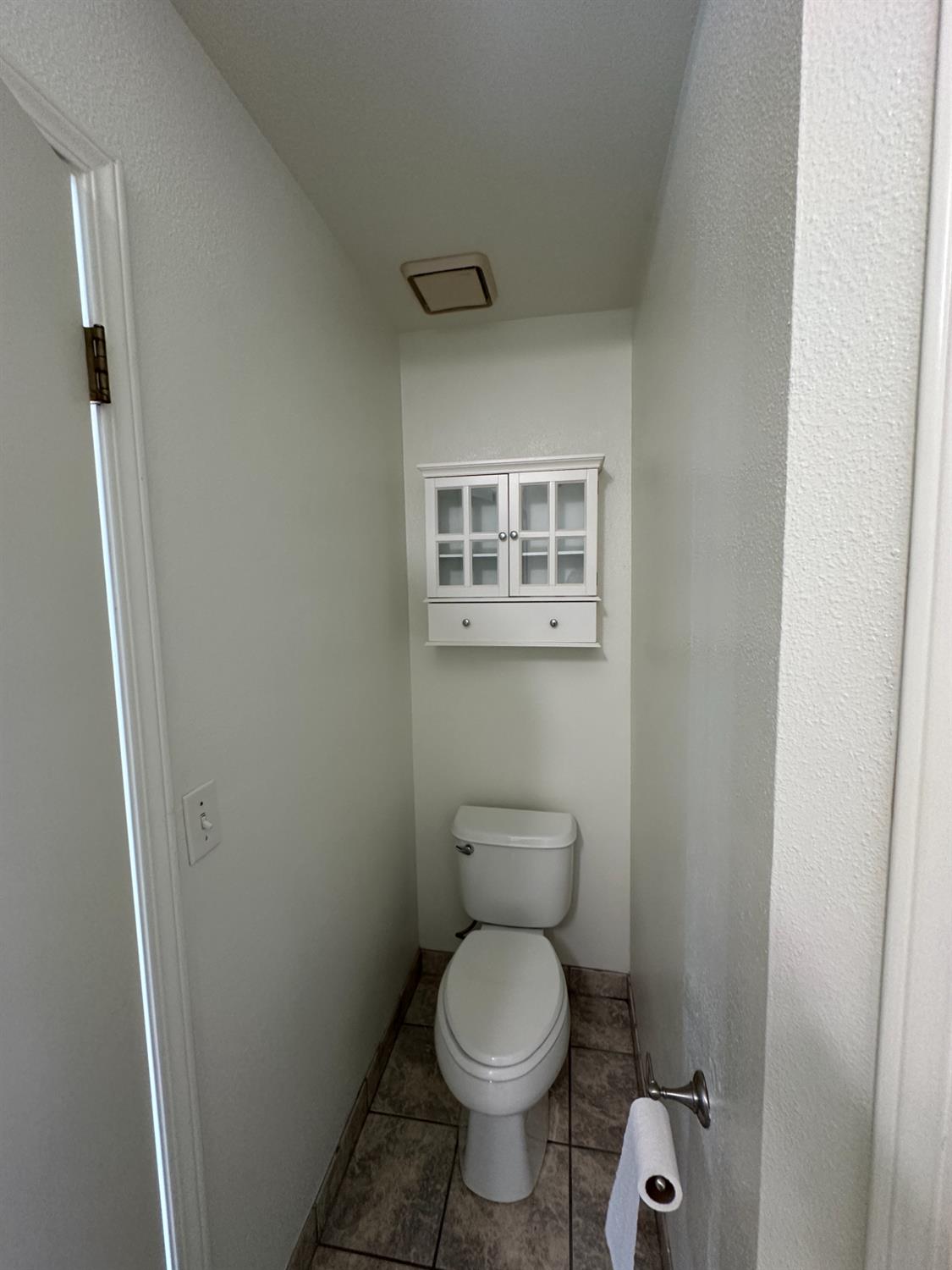 1816 East Frederick Avenue Fresno, CA 93720 - Photo 29 of 29 a bathroom with a toilet and a shower