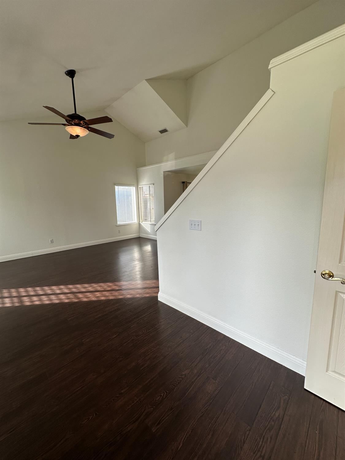 1816 East Frederick Avenue Fresno, CA 93720 - Photo 3 of 29 a view of empty room with wooden floor and fan