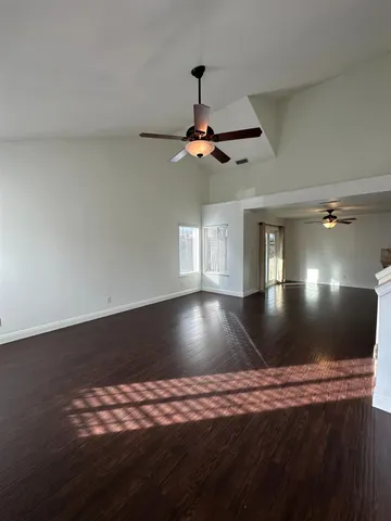 a view of room with window and ceiling fan